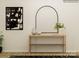 An entryway table decoratively staged with modern artwork and elegant decorative vases at 8418 Norman Forest Rd, Lancaster, SC 29720