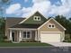 Charming one-story home with a covered porch, two-car garage, and landscaped front yard at 8418 Norman Forest Rd, Lancaster, SC 29720