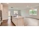 Kitchen featuring stainless steel appliances, an island with a sink, and wood-look flooring at 8418 Norman Forest Rd, Lancaster, SC 29720