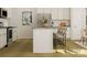 Kitchen featuring an island with seating, stainless steel appliances, and granite countertops at 8418 Norman Forest Rd, Lancaster, SC 29720