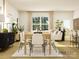 Open-concept living and dining area with neutral decor and ample natural light at 8418 Norman Forest Rd, Lancaster, SC 29720