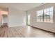 Bright living room features wood-look flooring and a glass door to the backyard at 8418 Norman Forest Rd, Lancaster, SC 29720