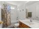 Bathroom with a shower-tub combo with a shower curtain at 10337 Hugue Way, Charlotte, NC 28214