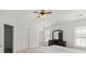 Bedroom with a ceiling fan and a dresser with a mirror at 10337 Hugue Way, Charlotte, NC 28214