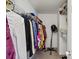 Walk-in closet with ample hanging space and shelving for storage at 10337 Hugue Way, Charlotte, NC 28214