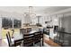 Eat-in kitchen features stainless steel appliances and access to the backyard at 10337 Hugue Way, Charlotte, NC 28214