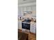 Well-lit kitchen features stainless steel appliances, modern cabinets, and ample counter space at 10337 Hugue Way, Charlotte, NC 28214