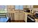 Charming kitchen with stainless steel appliances, updated backsplash, and lots of natural light at 10337 Hugue Way, Charlotte, NC 28214
