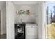 Laundry room with modern washer and dryer at 10337 Hugue Way, Charlotte, NC 28214