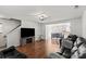 Open-concept living room leads to the eat-in kitchen with stainless steel appliances at 10337 Hugue Way, Charlotte, NC 28214