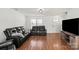 Spacious living room with hardwood floors and ample natural light at 10337 Hugue Way, Charlotte, NC 28214