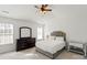 Bright and spacious main bedroom with neutral carpet, natural light, and tray ceilings at 10337 Hugue Way, Charlotte, NC 28214