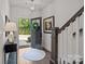 Inviting entryway with hardwood floors, stylish light fixture, stairs and decor elements at 1037 Naples Dr, Davidson, NC 28036