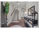 Inviting foyer with hardwood floors, elegant staircase, and stylish decor creating a warm, welcoming atmosphere at 1037 Naples Dr, Davidson, NC 28036