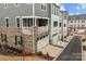 Townhome exterior with a brick facade and a driveway leading to a white garage door at 1037 Naples Dr, Davidson, NC 28036