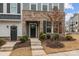 Inviting front entrance with brick accents and a well-maintained garden enhancing the home's curb appeal at 1037 Naples Dr, Davidson, NC 28036