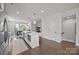 Bright, open kitchen with a large island, stainless steel appliances, and seamless flow to the dining area at 1037 Naples Dr, Davidson, NC 28036