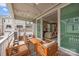 Relaxing outdoor patio with stylish wooden furniture, perfect for enjoying the fresh air and neighborhood views at 1037 Naples Dr, Davidson, NC 28036