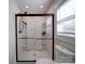 Bathroom with a large walk-in shower featuring a glass door and white interior at 10514 Lorelei Pl, Charlotte, NC 28227