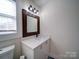 Bathroom featuring a vanity with a white countertop, a mirror, and a shower with black trim at 10514 Lorelei Pl, Charlotte, NC 28227