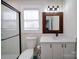 Bathroom featuring a vanity with a white countertop, and a shower with black trim at 10514 Lorelei Pl, Charlotte, NC 28227