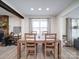 Open dining room featuring wood table set, wood flooring, and lots of natural light at 10514 Lorelei Pl, Charlotte, NC 28227