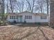 A light-colored ranch-style house with an inviting entrance and well-maintained landscaping at 10514 Lorelei Pl, Charlotte, NC 28227