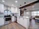 Bright and modern kitchen with white cabinets and stainless steel appliances at 10514 Lorelei Pl, Charlotte, NC 28227