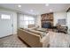 Bright living room with a stone fireplace and a view of the front entrance at 10514 Lorelei Pl, Charlotte, NC 28227