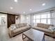 Living room with a rustic sliding barn door and view of the front entrance at 10514 Lorelei Pl, Charlotte, NC 28227