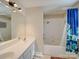 Bright bathroom featuring a shower-tub combo, modern fixtures and lots of natural light at 1162 W 1St St, Charlotte, NC 28202