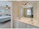 Bathroom featuring a double vanity, a large mirror and tile flooring at 1162 W 1St St, Charlotte, NC 28202