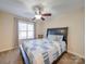 A cozy bedroom with a ceiling fan and a window for natural light at 1162 W 1St St, Charlotte, NC 28202