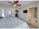 Comfortable bedroom featuring a ceiling fan, ensuite bathroom, and access to a private balcony at 1162 W 1St St, Charlotte, NC 28202