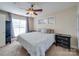 Relaxing bedroom featuring a comfortable bed, neutral walls, a ceiling fan, and a window at 1162 W 1St St, Charlotte, NC 28202