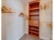 Walk-in closet featuring built-in shelving, hanging rods and ample storage space at 1162 W 1St St, Charlotte, NC 28202