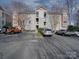 A parking lot view showcasing the front of the apartment building at 1162 W 1St St, Charlotte, NC 28202