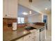 A view of the kitchen sink and the dining room beyond the breakfast bar at 1162 W 1St St, Charlotte, NC 28202