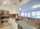 A partial view of the kitchen with stainless steel appliances and tile floors at 1162 W 1St St, Charlotte, NC 28202