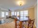 Open-concept living room featuring a dining area, hardwood floors, and an adjacent seating area at 1162 W 1St St, Charlotte, NC 28202