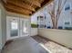 Private outdoor patio with white doors and a privacy fence at 1162 W 1St St, Charlotte, NC 28202