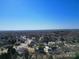 Panoramic aerial view of a peaceful residential neighborhood with lush trees and well-maintained homes at 12012 Stainsby Ln, Charlotte, NC 28273
