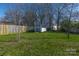 Well maintained backyard featuring a storage shed and mature trees at 12012 Stainsby Ln, Charlotte, NC 28273