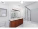 Bright bathroom featuring a double sink vanity, tile floors, and a glass enclosed shower at 12012 Stainsby Ln, Charlotte, NC 28273