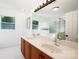 Well-lit bathroom with double vanity and large mirror at 12012 Stainsby Ln, Charlotte, NC 28273