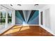 Bedroom with wood flooring and a large window providing plenty of natural light at 12012 Stainsby Ln, Charlotte, NC 28273