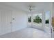 Bright breakfast nook features white walls, tile flooring, a ceiling fan and great views of the landscaped yard at 12012 Stainsby Ln, Charlotte, NC 28273