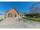 Charming house with brick accents, mature trees, and well-maintained landscaping at 12012 Stainsby Ln, Charlotte, NC 28273