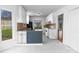 Updated kitchen featuring modern cabinets, stone countertops, and ample natural light at 12012 Stainsby Ln, Charlotte, NC 28273