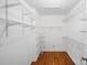 Walk-in closet features wood floor and wire shelving at 12012 Stainsby Ln, Charlotte, NC 28273